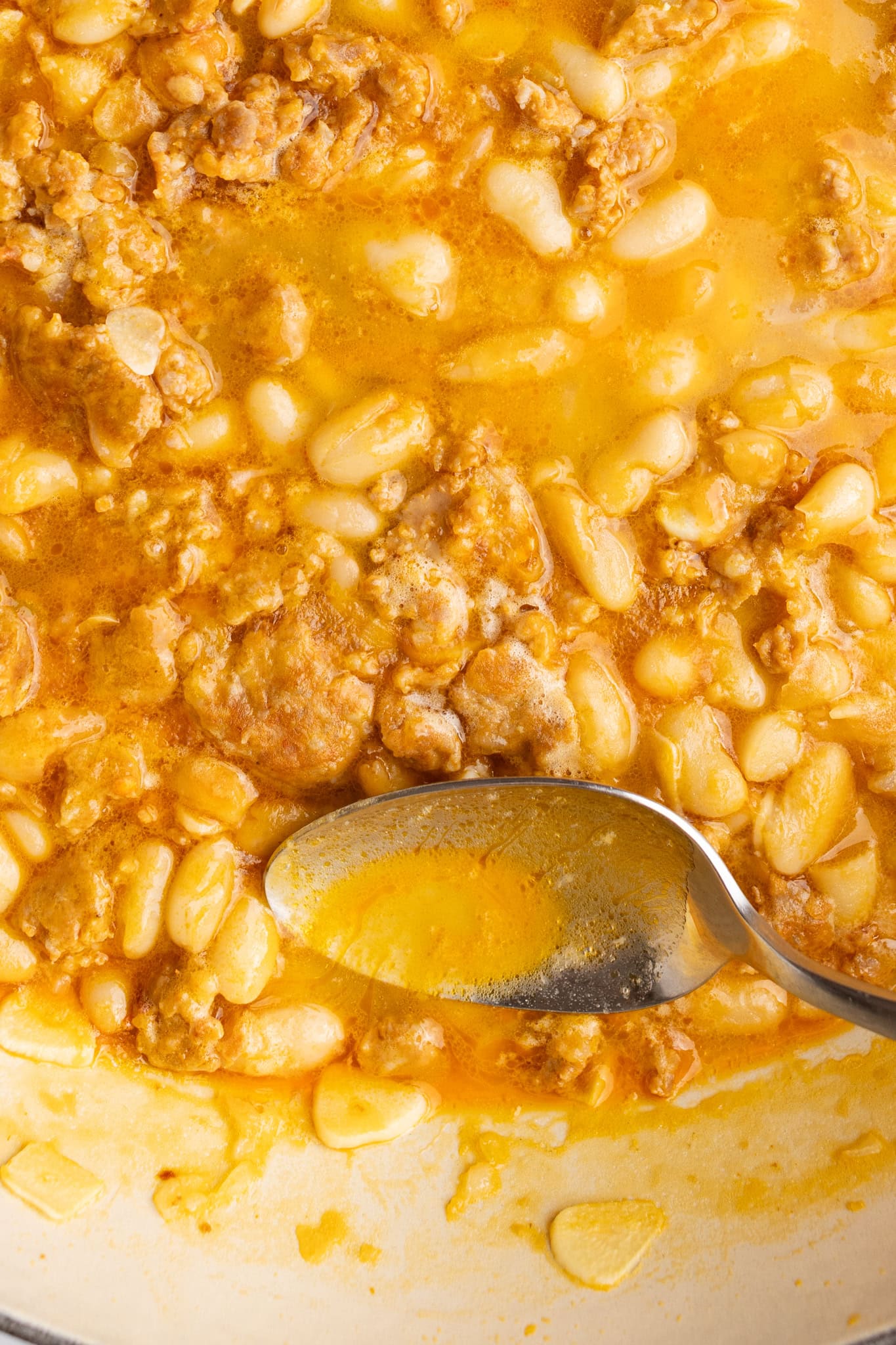 step by step: skimming the top layer of fat from the pan.